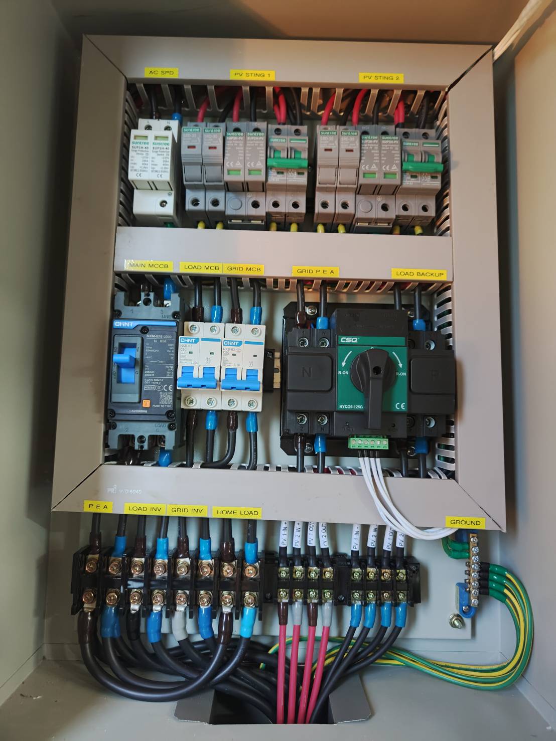 Modern white lithium battery storage unit with digital display mounted on wall in clean environment
